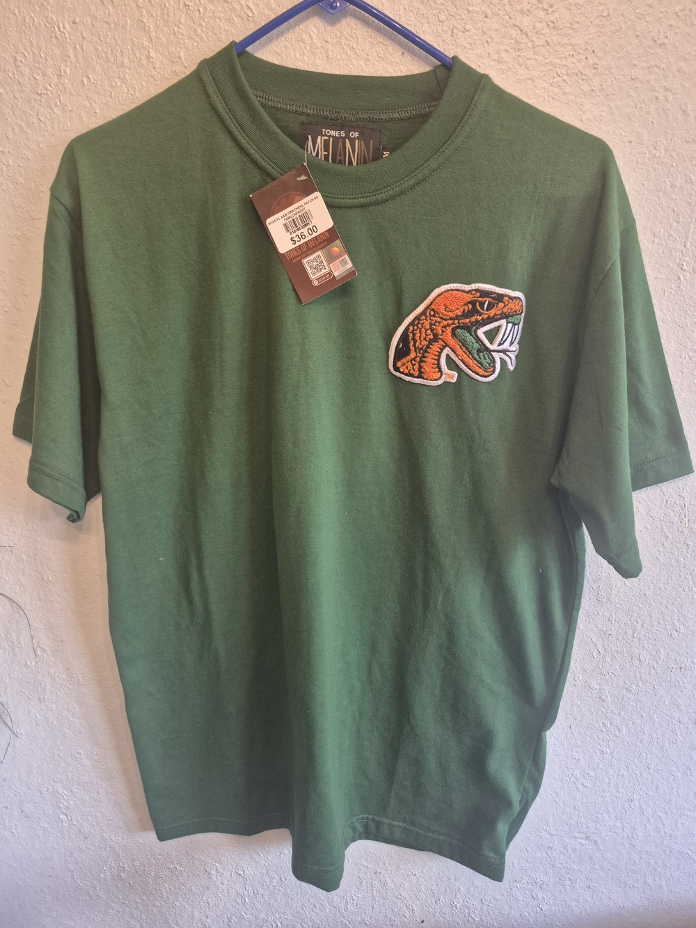 Tones of Melanin Green Tee with Orange Snake Patch